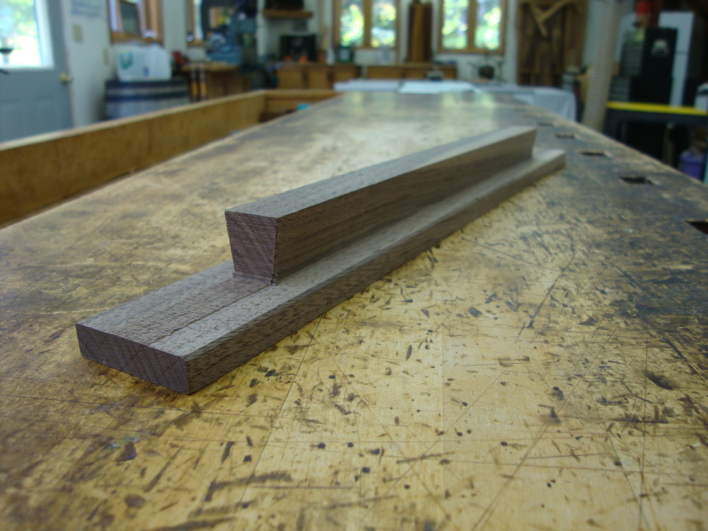 A view of the sliding dovetail which is fitted into the corresponding dovetails cut into both halves of the slab.